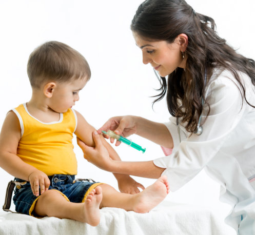 nurse injecting a vaccine to a child